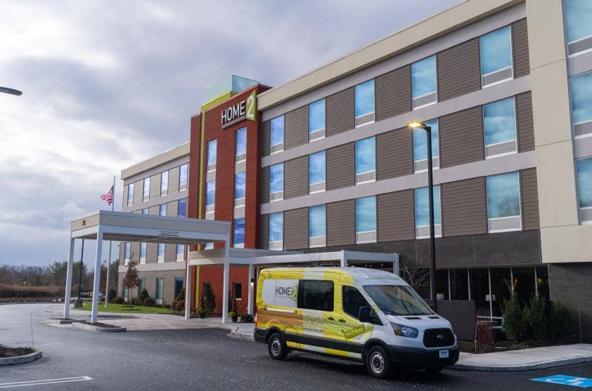 Home2 Suites building and van