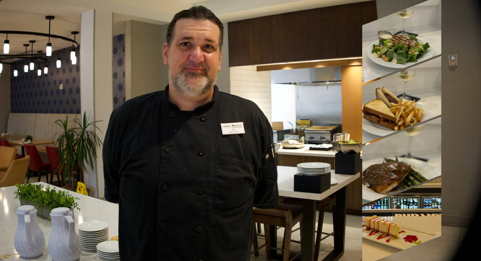 a man standing in a kitchen next to a counter