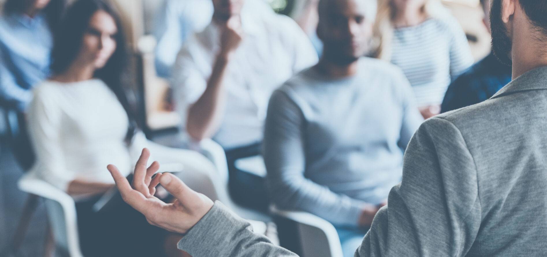 a man holding a conference