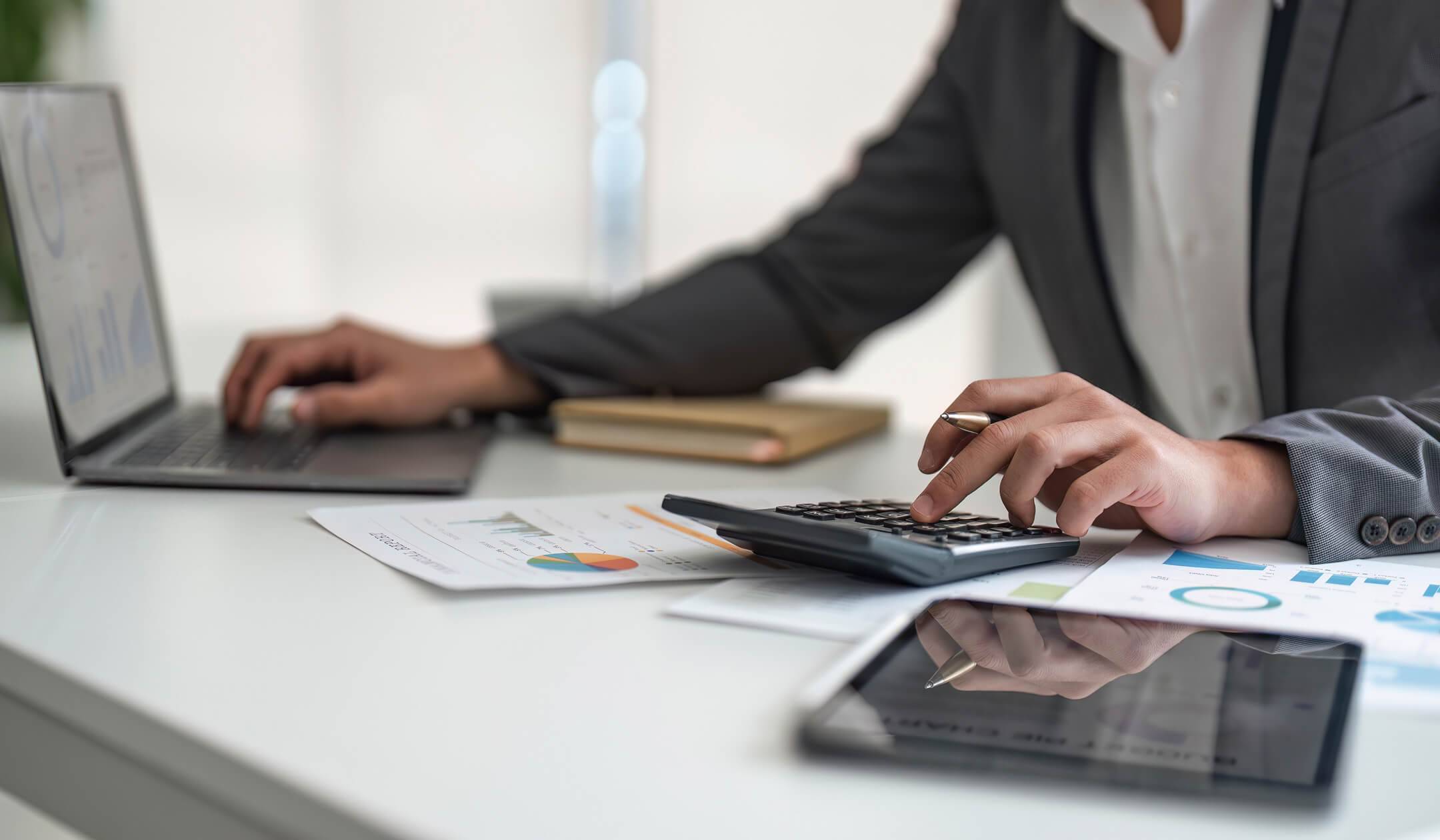 A man using a calculator