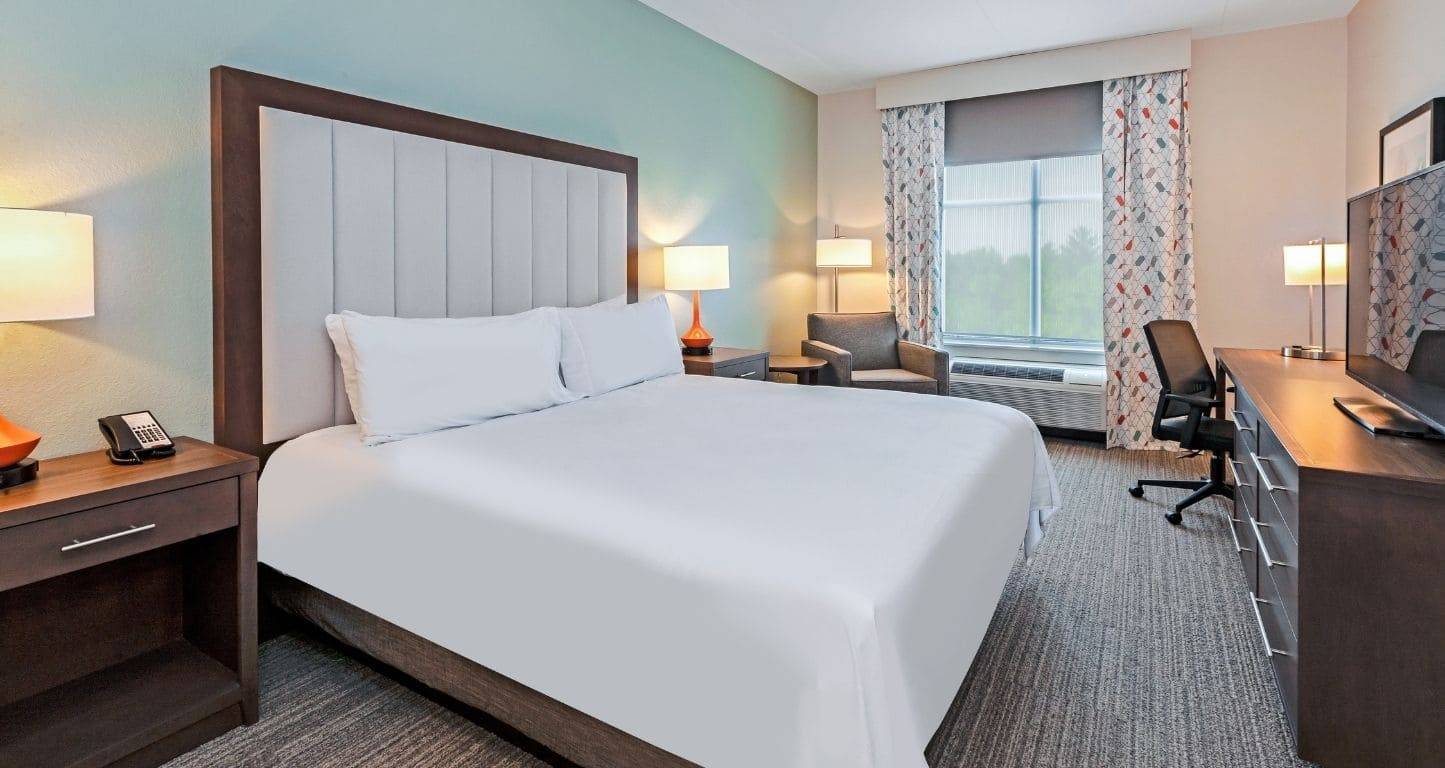 A king guest room at Homewood Suites Columbus Easton