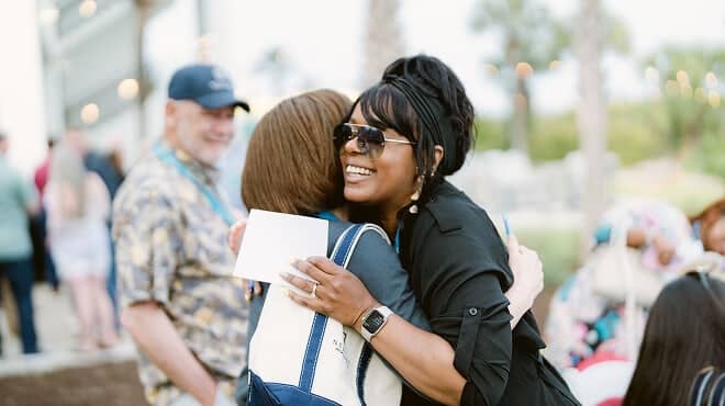 Two women hugging at the 2026 retreat