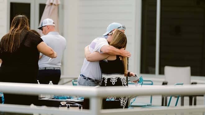 Two people hugging at the NHG retreat
