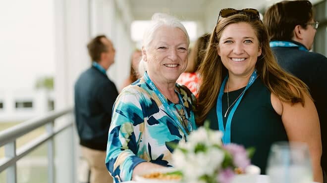 Two women smiling at the 2026 retreat