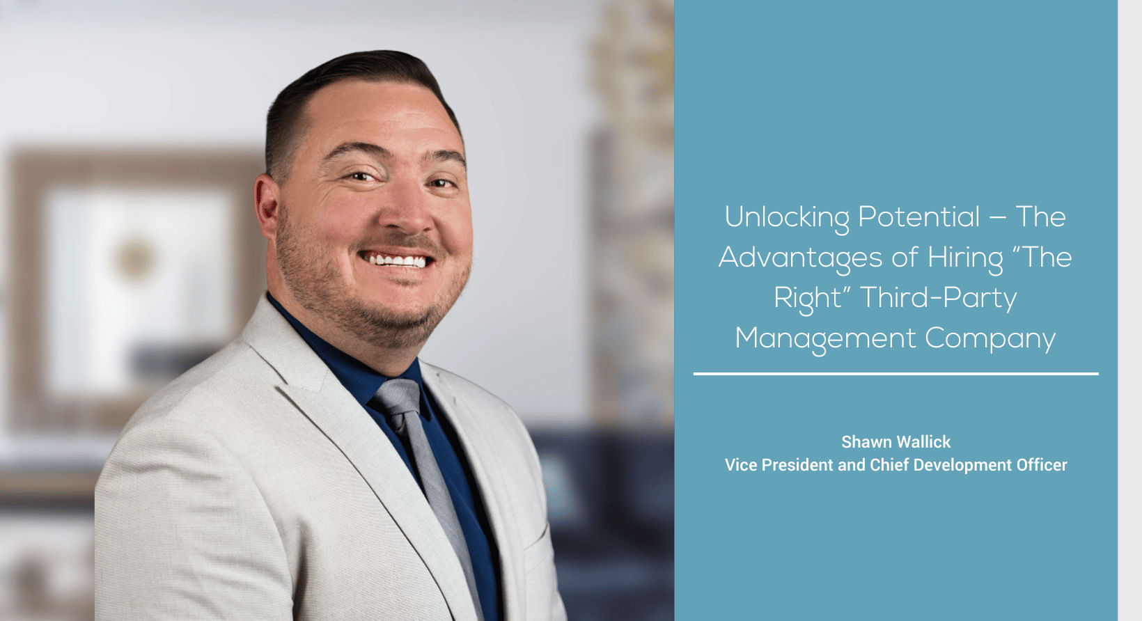 a man in a suit smiling for the camera