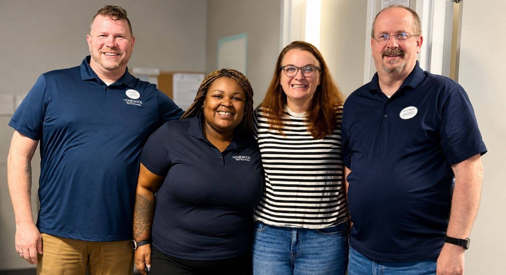 Four NHG team members standing together