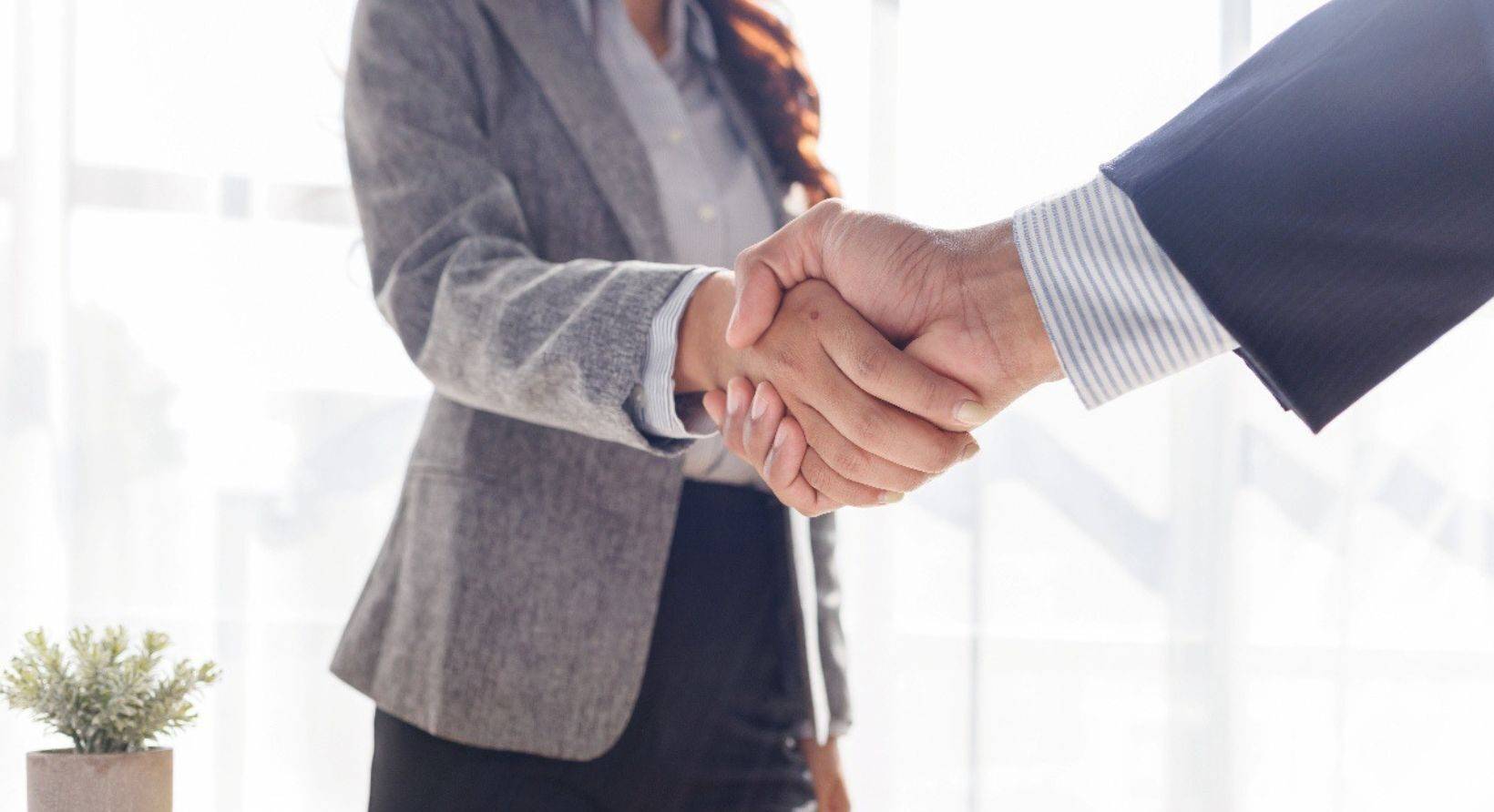 a man and woman shaking hands