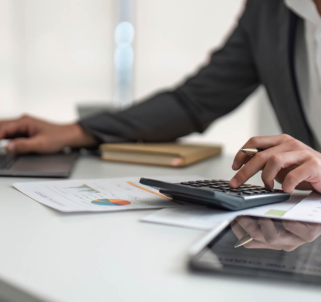 A man using a calculator