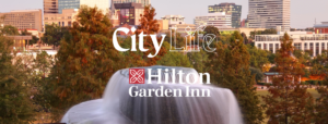 a picture of a city life with the words hilton garden inn