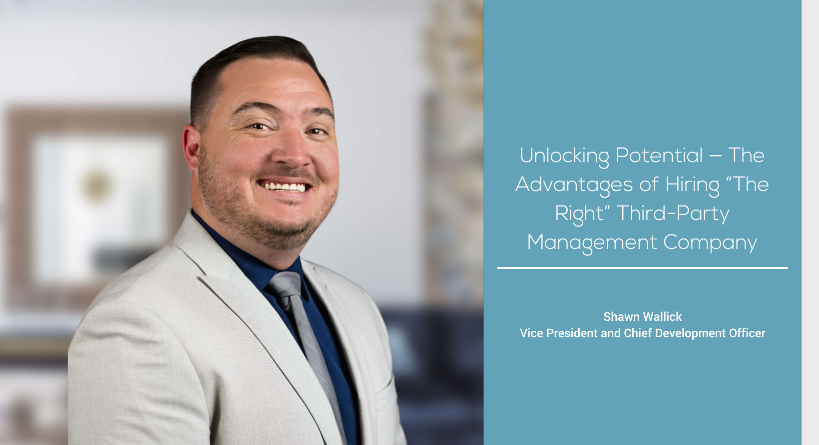 a man in a suit smiling for the camera